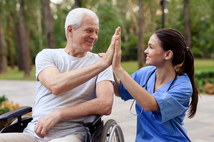 nurse-old-man-wheelchair-high-five